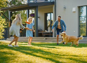 Family relaxes outside Family relaxes outside on summer day in central florida yard with no pests after green pest control from arrow services