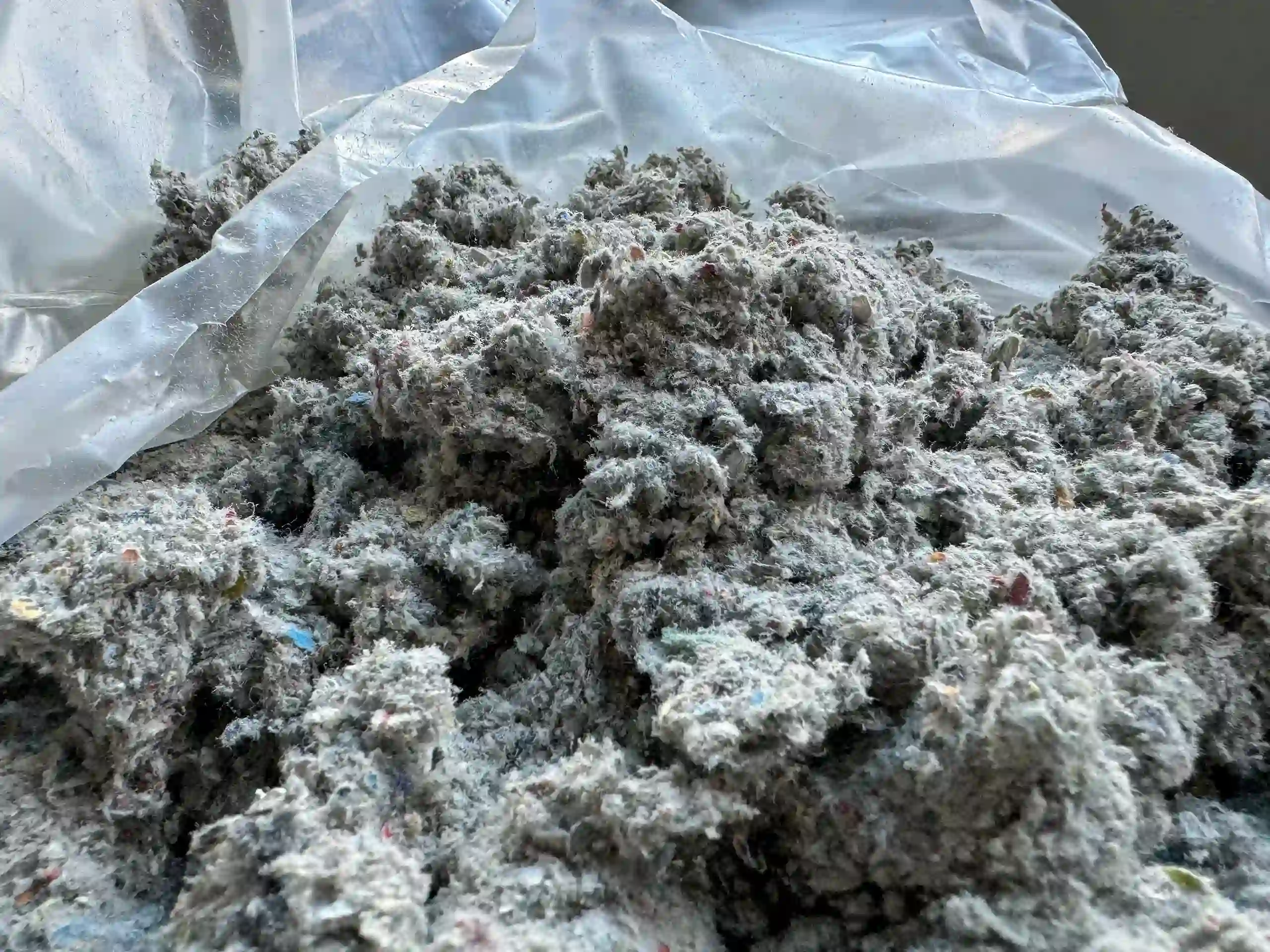 insulation-sample A clump of cellulose attic insulation