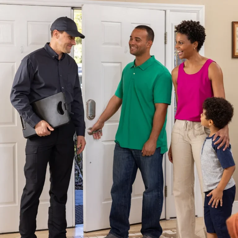 Arrow Services technician helping family inside their Florida home.