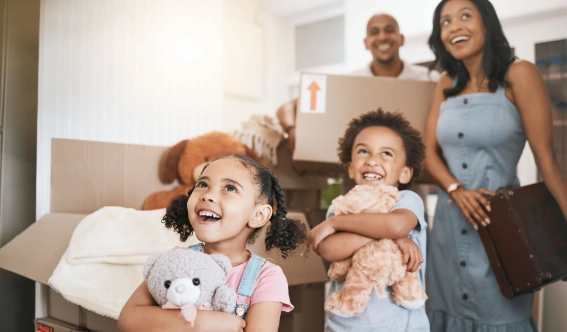 A happy family moving into a new Florida home, protected by Arrow Environmental Services’ move-in pest prevention treatments.
