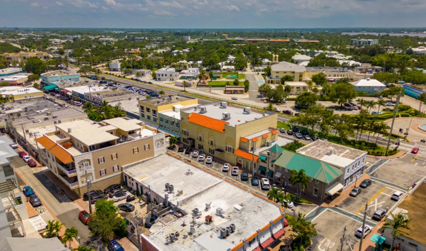 Ariel view of a vibrant Florida street highlighting Arrow Environmental Services’ commitment to serving local businesses and commercial properties.