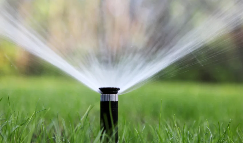 An active irrigation system watering a Florida lawn, optimized by Arrow Environmental Services for maximum water efficiency.